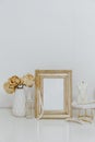 Feminine Mockup vintage gold frame and candle. Wedding still life. Royalty Free Stock Photo