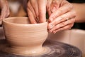 Feminine potter teaches