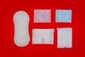 Feminine sanitary napkin on red background Royalty Free Stock Photo