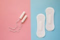 Feminine sanitary pad and tampon on a pink background. The concept of feminine hygiene during menstruation. Flat lay, top view Royalty Free Stock Photo