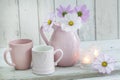 Feminine still life with candles, a heart mug and flowers Royalty Free Stock Photo