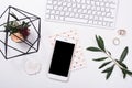 feminine tabletop flatlay with smartphone mock-up