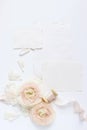 Feminine wedding, birthday desktop mock-up scene. Blank craft paper greeting cards, silk ribbon and blush pink Persian Royalty Free Stock Photo