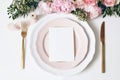 Feminine wedding, birthday desktop mock-up scene. Porcelain plates, blank paper greeting, menu card, ribbon, golden Royalty Free Stock Photo