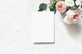 Feminine wedding, birthday mock-up scene. Blank paper greeting card. Bouquet of blush pink English roses, ranunculus Royalty Free Stock Photo