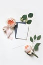 Feminine wedding, birthday mock-up scene. Blank paper greeting cards, envelope, silk ribbon, eucalyptus leaves and blush
