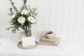 Feminine wedding or birthday table mockup scene with floral bouquet. White peonies, tanacetum flowers, eucalyptus