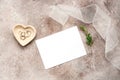 Feminine wedding invitation card. Blank white paper card mock up, bowl heart with jewelry, ribbon and green branch on beige