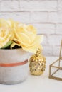 Feminine workplace concept. Freelance fashion comfortable femininity workspace with flowers and golden pineapple on white backgrou