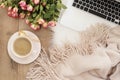 Feminine workplace concept. Freelance workspace with laptop, flowers roses. Blogger working. Royalty Free Stock Photo