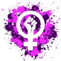 feminist icon with clenched fist. Pink and purple ink splashes. Vector illustration