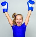 Feminist movement. Strong child proud winner boxing competition. Girl child happy winner with boxing gloves posing on