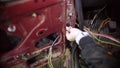 feminized blonde car service master girl changes electric wires in old car