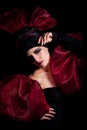 Femme fatale in a red-black dress