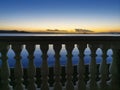 Fence against the backdrop of a sunset seascape Royalty Free Stock Photo
