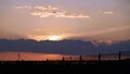 Fence against the setting sun. backlit photo