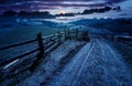 Fence along the country road at night Royalty Free Stock Photo