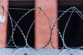 Fence with barbed wire. focus with shallow depth of field. Royalty Free Stock Photo