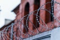 Fence with barbed wire. focus with shallow depth of field. Royalty Free Stock Photo