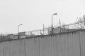 Fence with barbed wire, place of detention