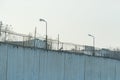 Fence with barbed wire, place of detention