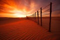 Fence in the desert with the sun setting behind it. Generative AI Royalty Free Stock Photo