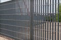 Fence: detail of a fence with stainless steel electro-welded metal grid. Royalty Free Stock Photo