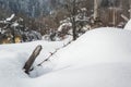 Fence details covered in snow in winter landscape - iced barb wire and wood at snow covered meadow in countryside Royalty Free Stock Photo