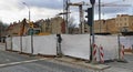 The fence encloses the construction site for the renovation of sewer underground utilities on Gedimino Street