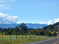 Fence going parallel to the road Royalty Free Stock Photo