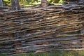 Fence in the form of a rural wattle fence Royalty Free Stock Photo