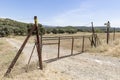 A fence with gate on a country road in Almaden de la Plata