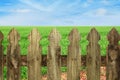 wooden picket fence grass and blue sky Royalty Free Stock Photo