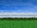 Fence on a grass field under a blue sky Royalty Free Stock Photo