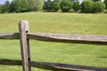 Fence and green field Royalty Free Stock Photo