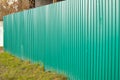 fence with green metal siding, the concept of security and protection Royalty Free Stock Photo