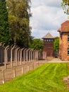 Fence and guard tower of concentration camp