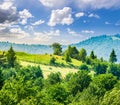 Fence on hillside meadow in mountain at sunrise Royalty Free Stock Photo