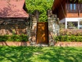 Fence home material is brick and mortar,Door material wood,Home Architecture surrounded by nature Royalty Free Stock Photo