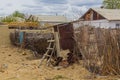 Fence and a house in former port town Moynaq Mo ynoq or Muynak , Uzbekist Royalty Free Stock Photo