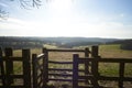 Fence and kissing gate in a rural landscape Royalty Free Stock Photo