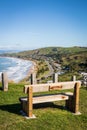 Fence line and memorial seat at hilltop scenic lookout, Makorori Headland, near Gisborne East Coast, North Island, New Zealand