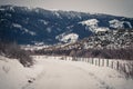 Fence-lined Country Road During Winter Royalty Free Stock Photo