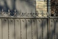 A fence made of black sharp iron forged pattern Royalty Free Stock Photo