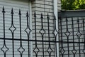 A fence made of black sharp iron rods Royalty Free Stock Photo