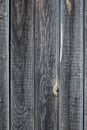 A fence made of pine boards. Old, worn, cracked board. Texture, background