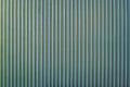 Fence made of strips of gray aluminum pipes. Vertical parallel lines. Abstract texture background Royalty Free Stock Photo