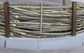 Fence made of thin wooden rods in natural light Royalty Free Stock Photo