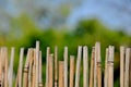 A fence made of twigs in the garden Royalty Free Stock Photo