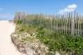 Fence made of wooden slats in the dunes Royalty Free Stock Photo